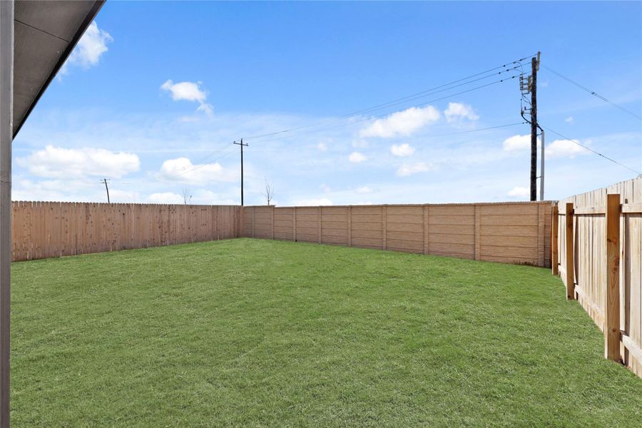 Building on the home's outdoor appeal, this expansive backyard is fully enclosed by a high-quality privacy fence and offers a large, level lawn with endless potential for play, pets, or a future garden.