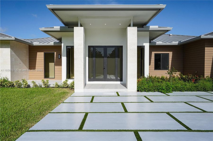 Front exterior of a new home in , Homestead, FL, highlighting curb appeal (Image 27).