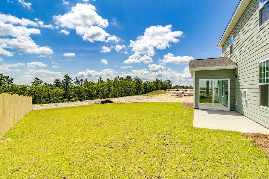 Exterior details and patio area of a home in Gates at Windermere, Blythewood (Image 22).