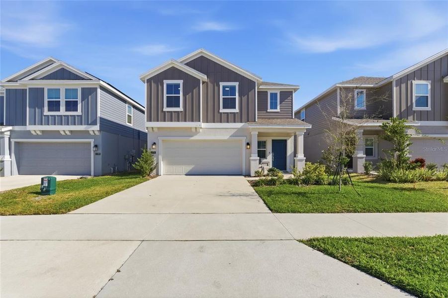 Front exterior of a new home in , Winter Haven, FL, highlighting curb appeal (Image 1). Front exterior of a new home in , Winter Haven, FL, highlighting curb appeal (Image 1).