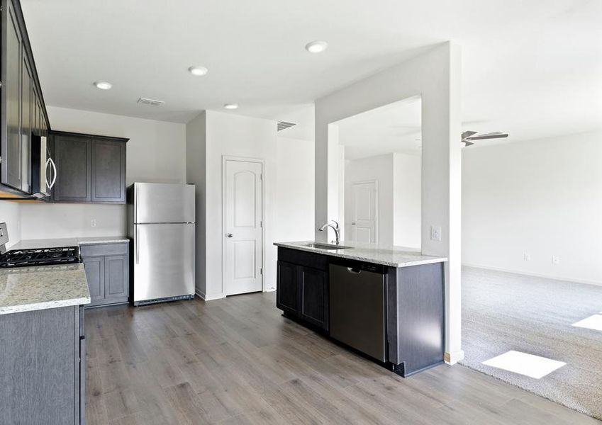 The kitchen has sprawling granite countertops.