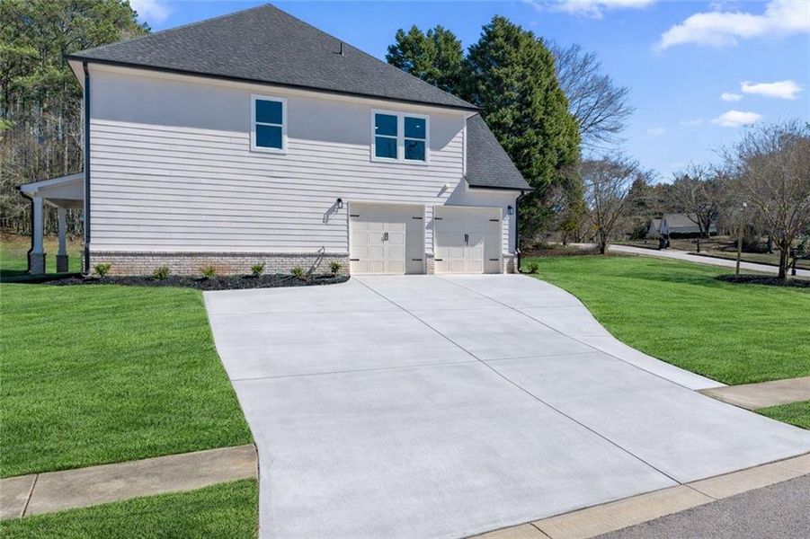 Front exterior of a new home in , Stockbridge, GA, highlighting curb appeal (Image 27). Front exterior of a new home in , Stockbridge, GA, highlighting curb appeal (Image 27).