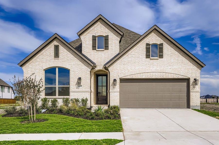French provincial home with brick siding, driveway, a front yard, and a shingled roof French provincial home with brick siding, driveway, a front yard, and a shingled roof