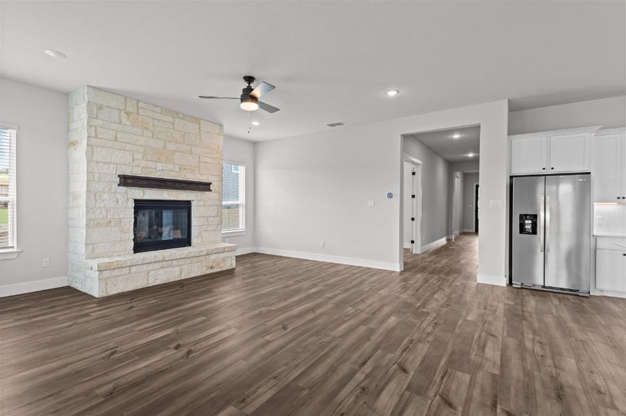 A large kitchen with a fireplace.