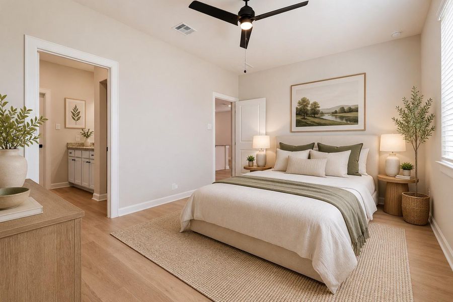 This photo of the primary bedroom has been virtually staged.