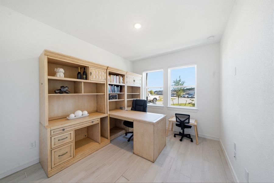 Bright and airy 5the Bedroom OR home office featuring a large window with a view.