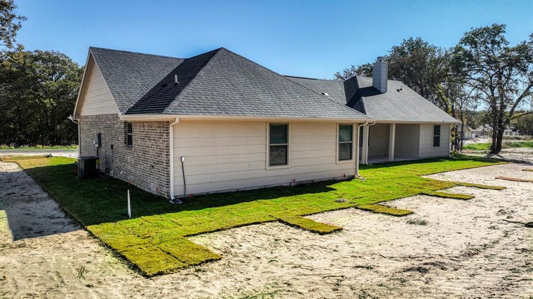 Exterior details and patio area of a home in , Poolville (Image 3).