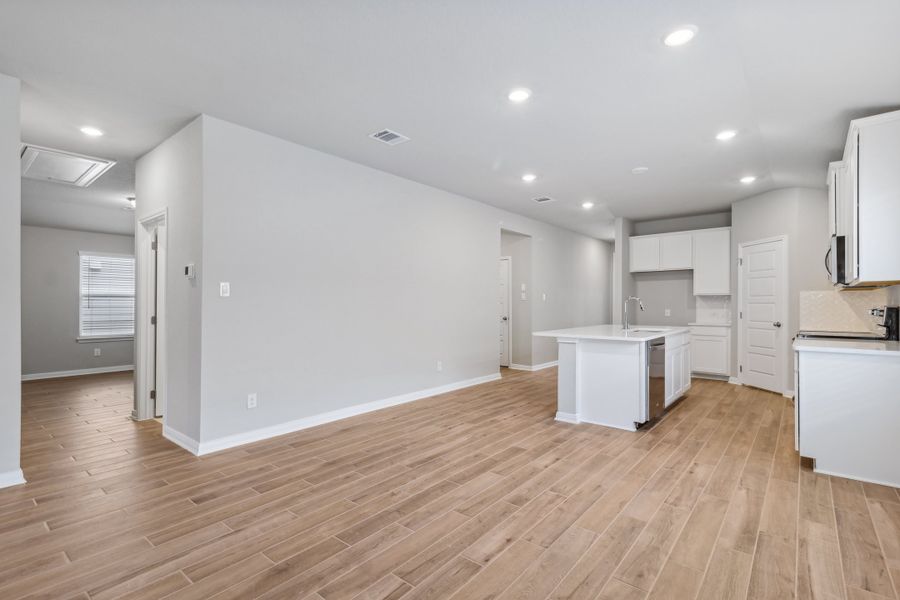 Dining room and kitchen in the Allen floorplan at a Meritage Homes community. Dining room and kitchen in the Allen floorplan at a Meritage Homes community.