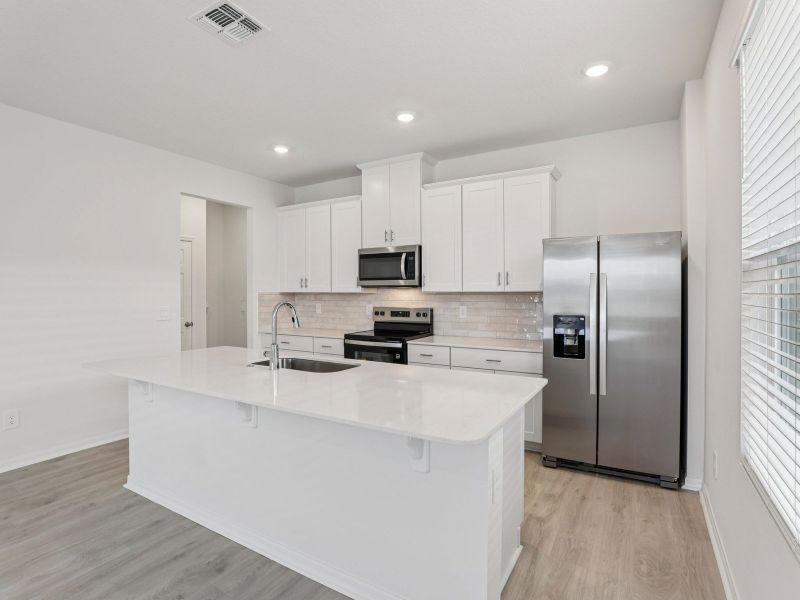 Furnished interior view inside a new home in The Meadow at Crossprairie Bungalows, St. Cloud (Image 4).