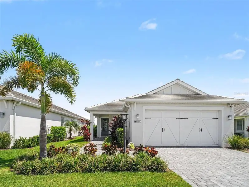 Front exterior of a new home in , Sarasota, FL, highlighting curb appeal (Image 1). Front exterior of a new home in , Sarasota, FL, highlighting curb appeal (Image 1).