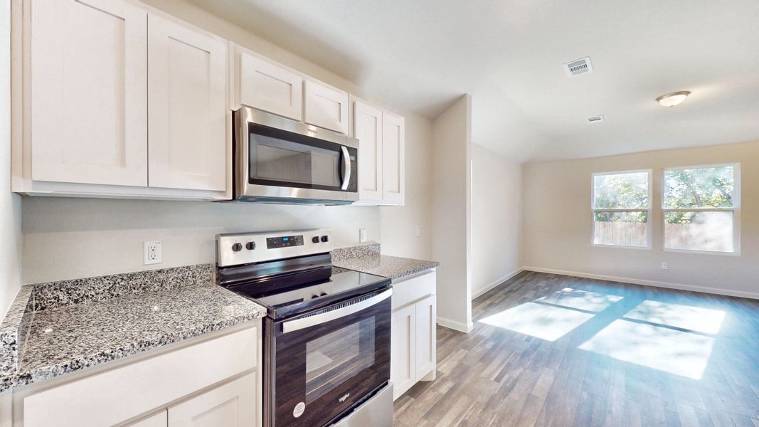 A kitchen with white cabinets. A kitchen with white cabinets.