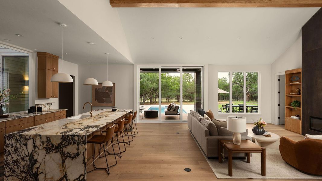 A spacious, airy interior offers seamless transitions to the pool and green landscape through large sliders A spacious, airy interior offers seamless transitions to the pool and green landscape through large sliders