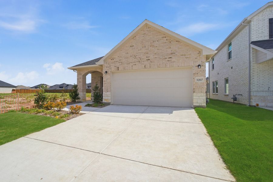 Front exterior of a new home in Westridge, McKinney, TX, highlighting curb appeal (Image 17). Front exterior of a new home in Westridge, McKinney, TX, highlighting curb appeal (Image 17).