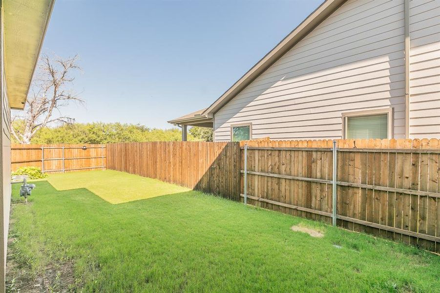 View of fenced backyard
