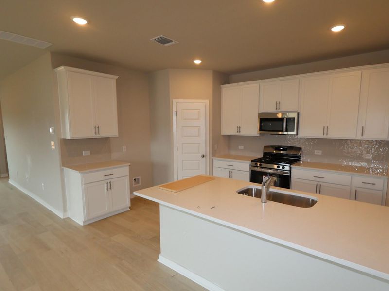 Furnished interior view inside a new home in Heritage, Dripping Springs (Image 5).