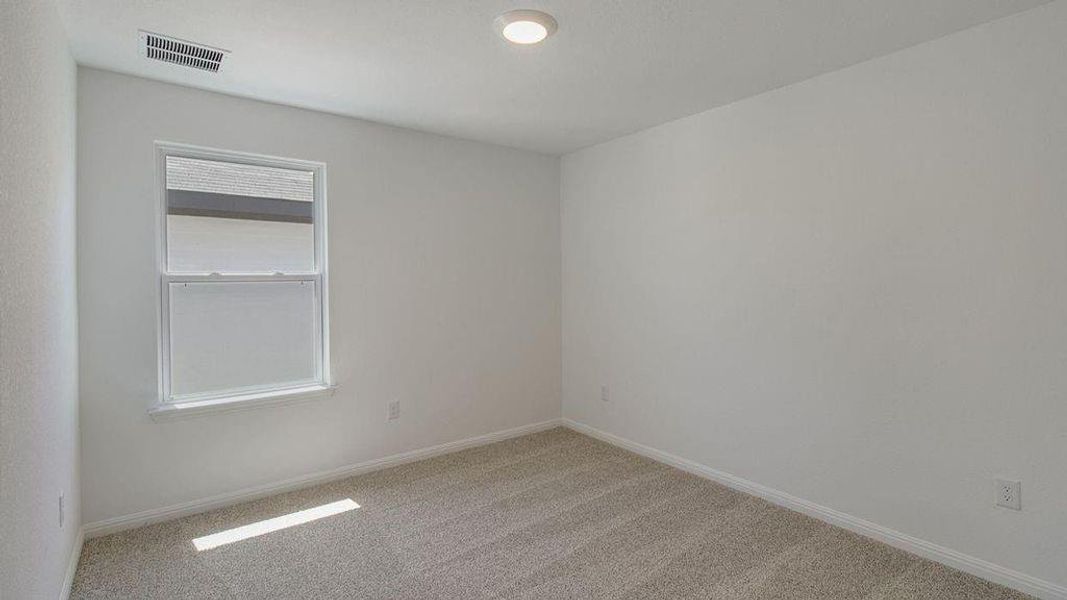 Spacious, unfurnished interior of a new home in Caldwell Crossing, Iowa Colony (Image 6).