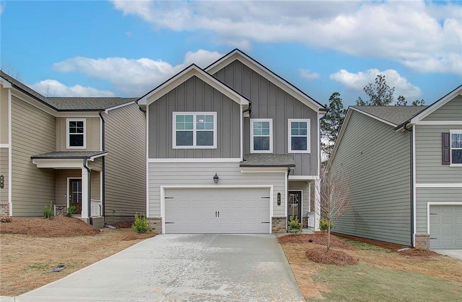 Front exterior of a new home in Crofton Place Enclave, Snellville, GA, highlighting curb appeal (Image 21).