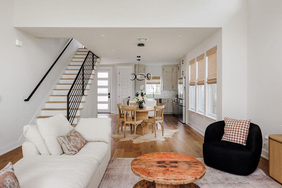Living room with baseboards and light wood-style floors