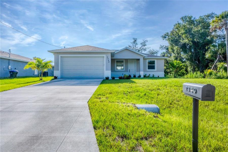 Front exterior of a new home in , North Port, FL, highlighting curb appeal (Image 19).