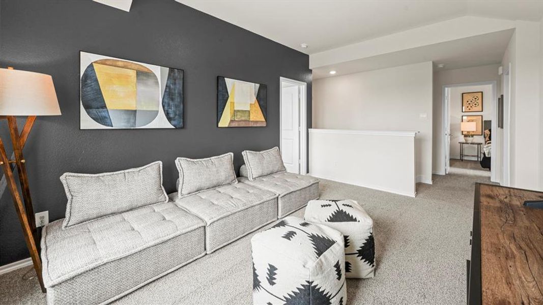 Living area featuring carpet floors and baseboards