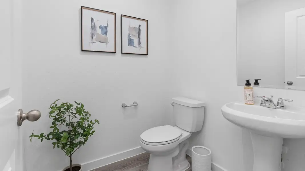 Furnished interior view inside a new home in Caldwell Crossing, Iowa Colony (Image 9).