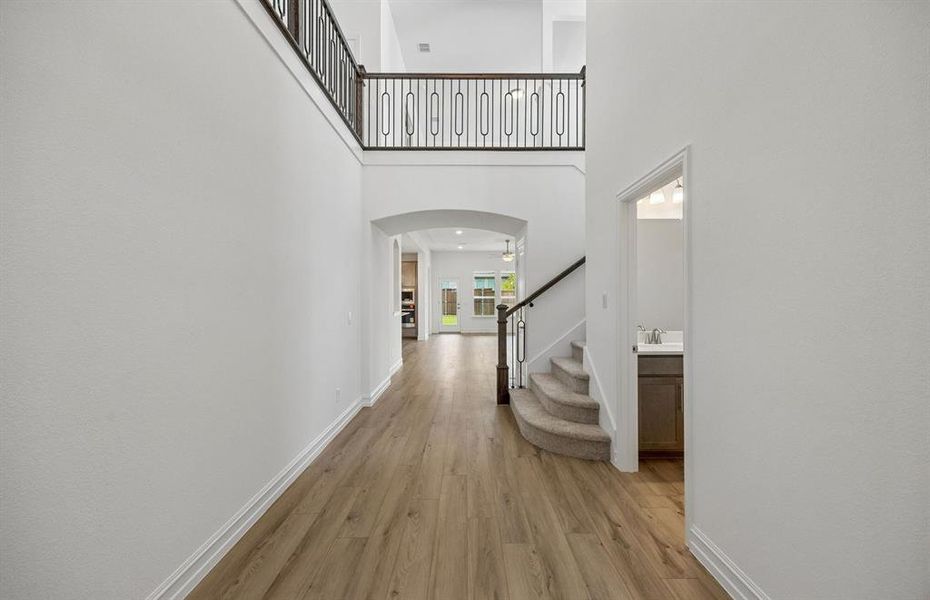 Welcoming entry into home with soaring ceilings