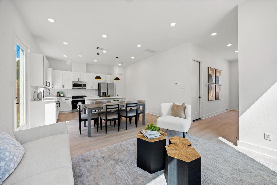 The open concept living space connects the living, dining, and kitchen areas—perfect for both everyday living and entertaining! The open concept living space connects the living, dining, and kitchen areas—perfect for both everyday living and entertaining!