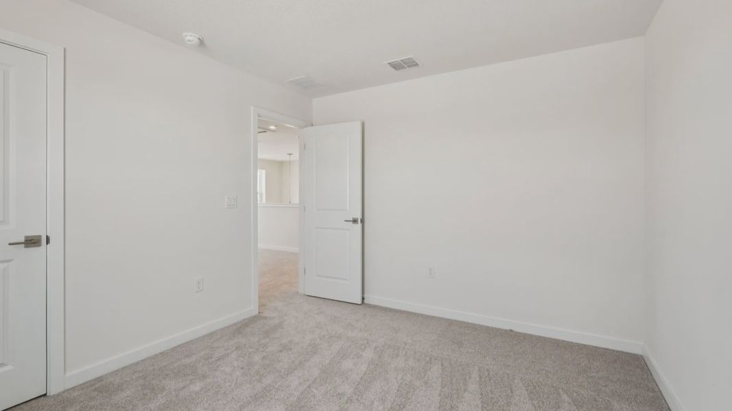 Secondary Bedroom located in the Jupiter in Hamilton Bluff located in Haines City, FL.