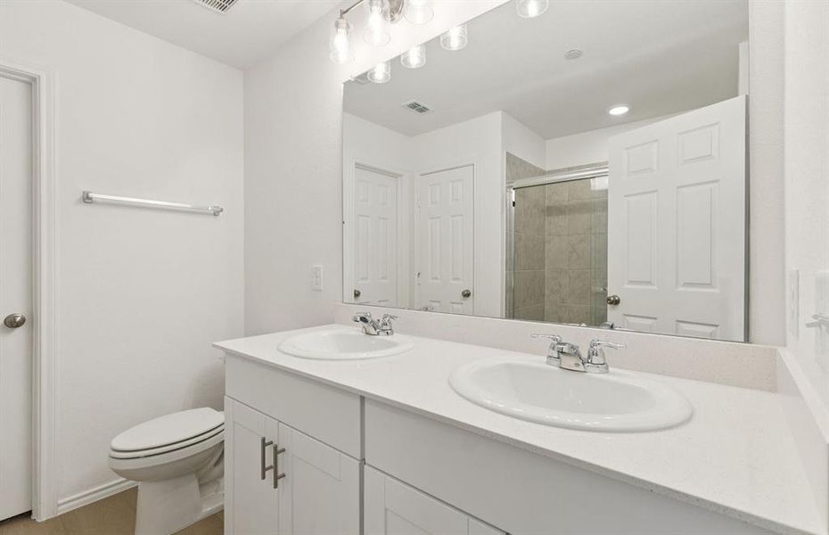 Owner's private bath with double vanity