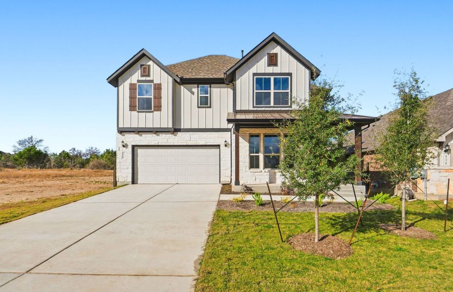 Front exterior of a new home in Saddleback at Santa Rita Ranch, Liberty Hill, TX, highlighting curb appeal (Image 24).