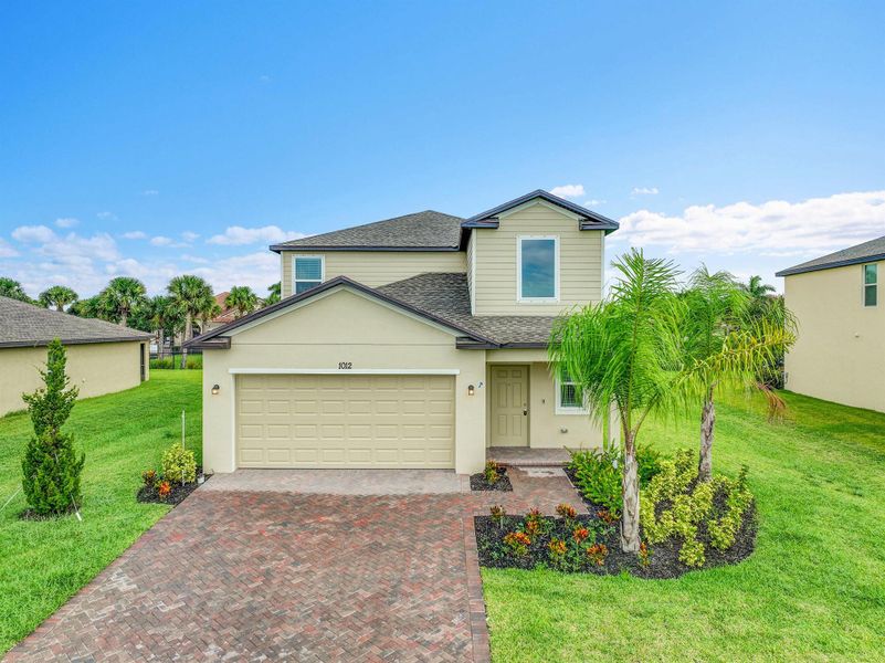 Front exterior of a new home in Bent Creek: The Meadows Collection, Fort Pierce, FL, highlighting curb appeal (Image 19).