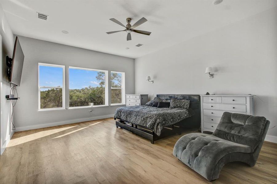 Bedroom featuring wood finished floors and ceiling fan