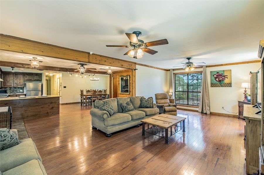 Open-concept living space with country charm and views of the surrounding property. Open-concept living space with country charm and views of the surrounding property.