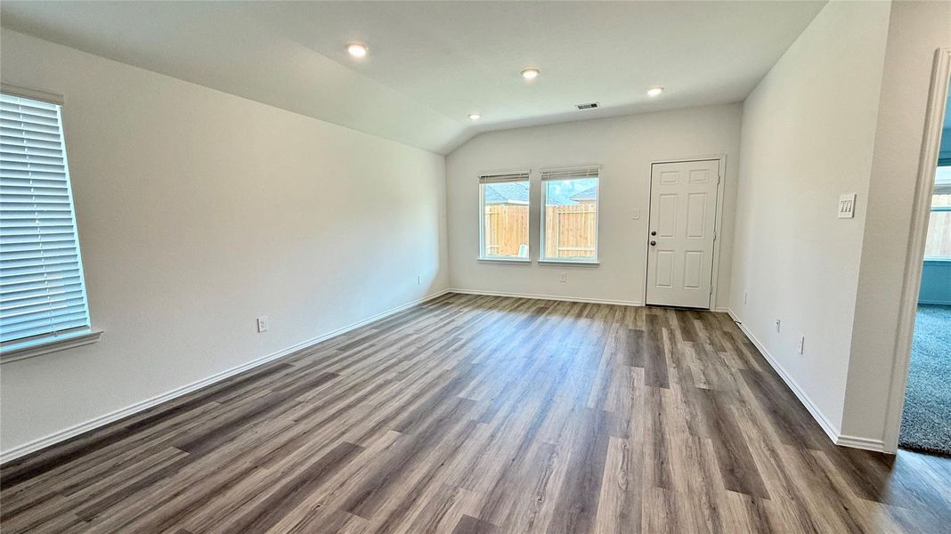 Bright, open-concept living room filled with natural light. A home truly loved and enjoyed by the current tenants—you have to see it in person to appreciate its warmth and charm.