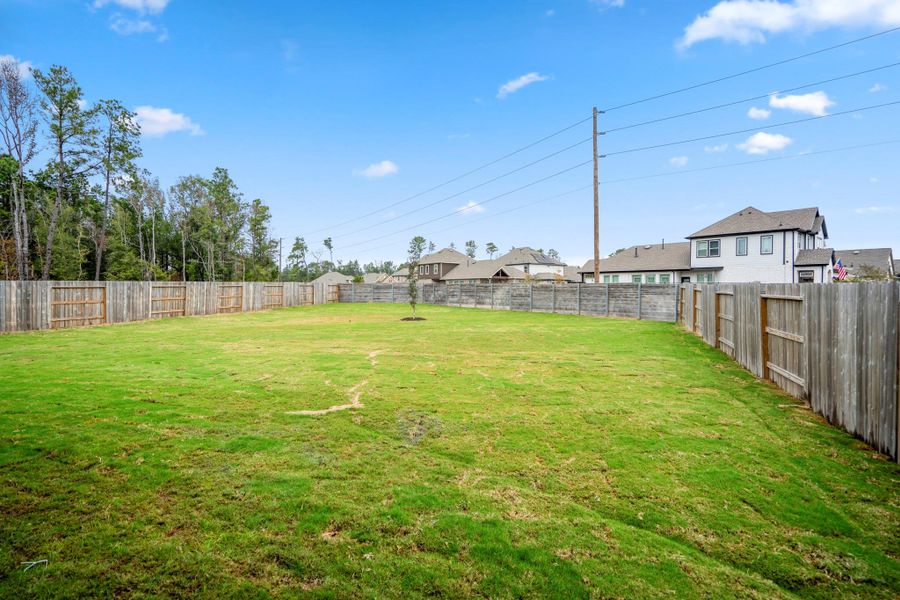 Exterior details and patio area of a home in ARTAVIA 55' Lots, Conroe (Image 29).