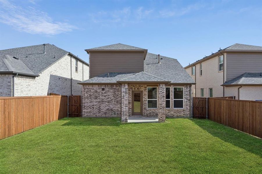 Exterior details and patio area of a home in Santorini, Seagoville (Image 3).