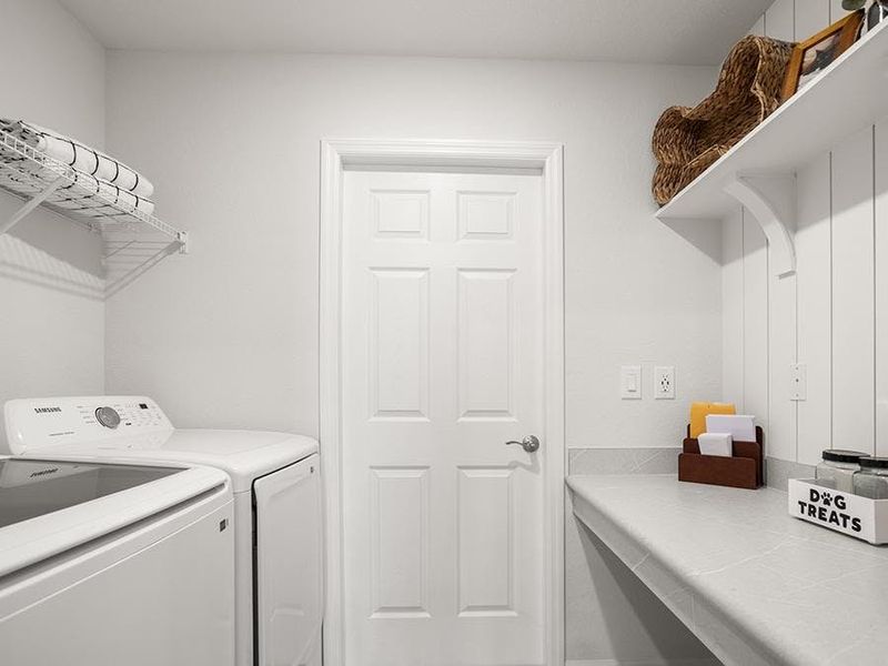 A built-in drop zone keeps clutter off the kitchen counter - Parker by Highland Homes A built-in drop zone keeps clutter off the kitchen counter - Parker by Highland Homes