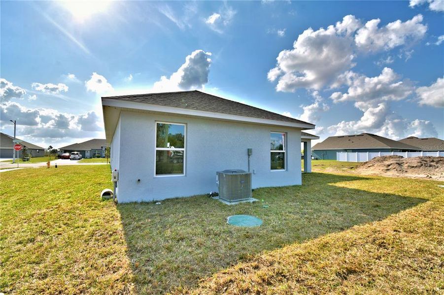 Exterior details and patio area of a home in Cadence Crossing, Auburndale (Image 30).