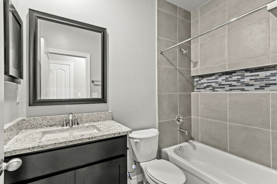 Furnished interior view inside a new home in Paseos Del Este, Horizon City (Image 9).