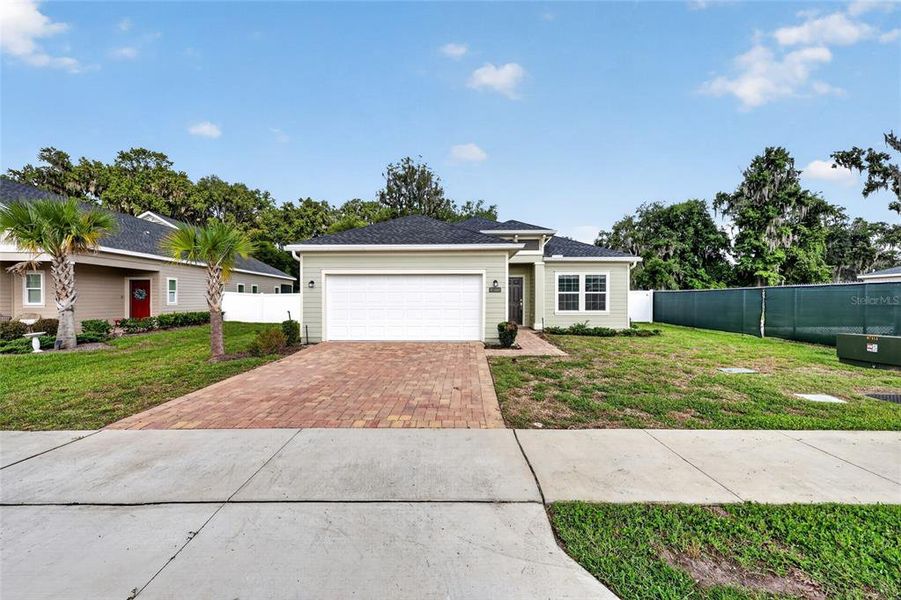Front exterior of a new home in Heath Preserve, Ocala, FL, highlighting curb appeal (Image 24).