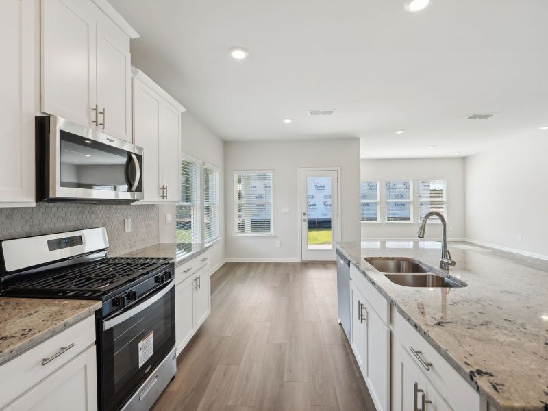 Furnished interior view inside a new home in Martin Springs - Estate Series, Lawrenceville (Image 10).