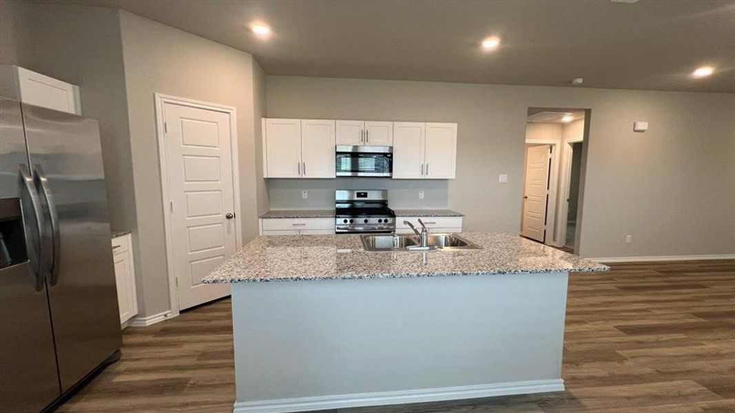 Kitchen- All Home and community information, including pricing, included features, terms, availability and amenities, are subject to change at any time without notice or obligation. All Drawings, pictures, photographs, video, square footages, floor plans, elevations, features, colors and sizes are approximate for illustration purposes only and will vary from the homes as built. Kitchen- All Home and community information, including pricing, included features, terms, availability and amenities, are subject to change at any time without notice or obligation. All Drawings, pictures, photographs, video, square footages, floor plans, elevations, features, colors and sizes are approximate for illustration purposes only and will vary from the homes as built.
