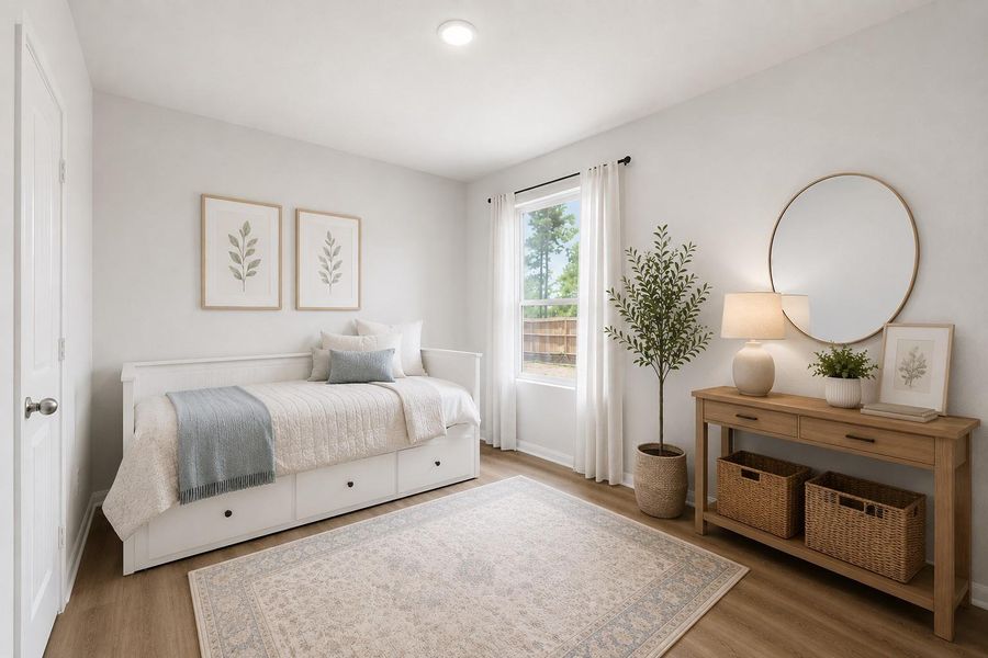 Bright and inviting 3rd bedroom on the 1st floor with a cozy daybed, and natural light streaming through a large window, creating a serene atmosphere. *Virtually staged