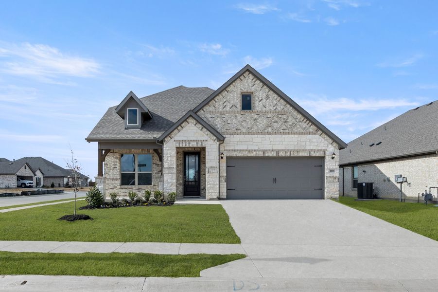 Front exterior of a new home in Timberbrook, Justin, TX, highlighting curb appeal (Image 1). Front exterior of a new home in Timberbrook, Justin, TX, highlighting curb appeal (Image 1).