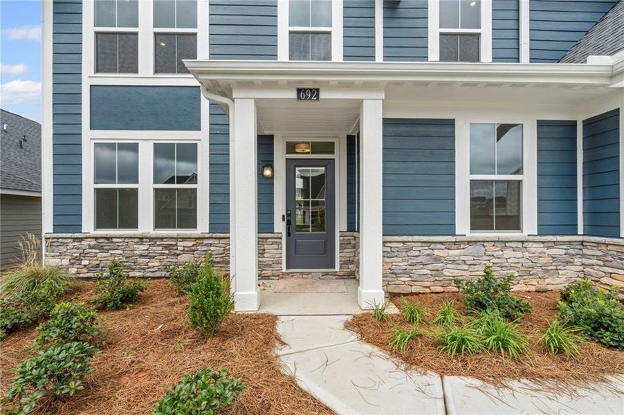 Front exterior of a new home in Twin Lakes, Hoschton, GA, highlighting curb appeal (Image 20).