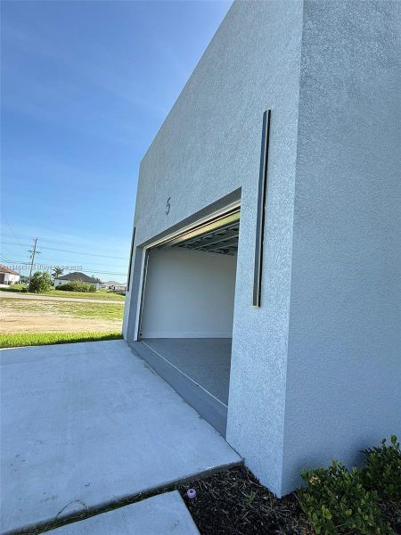 Front exterior of a new home in , Cape Coral, FL, highlighting curb appeal (Image 22).