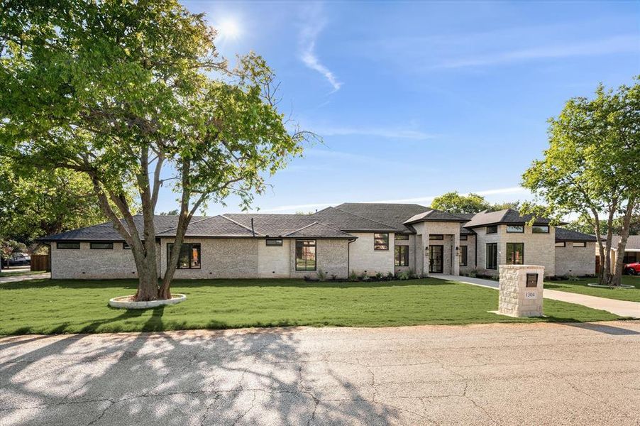 Prairie-style home with a front lawn