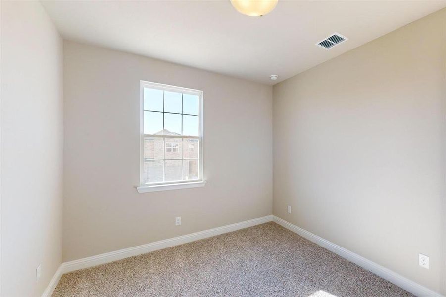 Unfurnished room featuring carpet