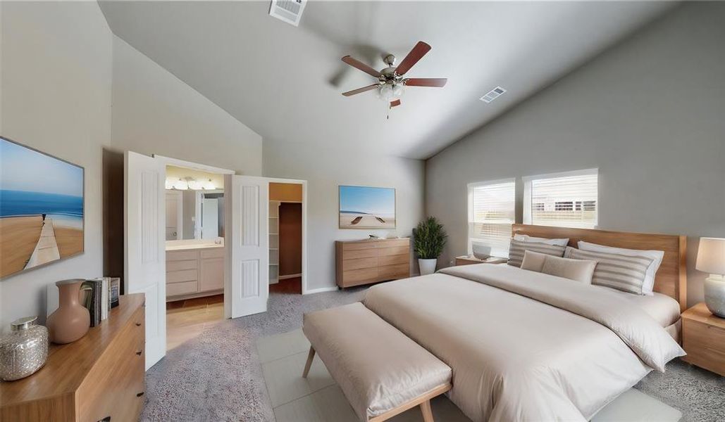 The primary bedroom offers atranquil retreat with plushcarpeting, a ceiling fan, and amplenatural light from the largewindows. The double doors lead toa private en-suite bathroom,ensuring a perfect blend of comfortand privacy. This is a picture of anElise Floor Plan with anotherSaratoga Homes.