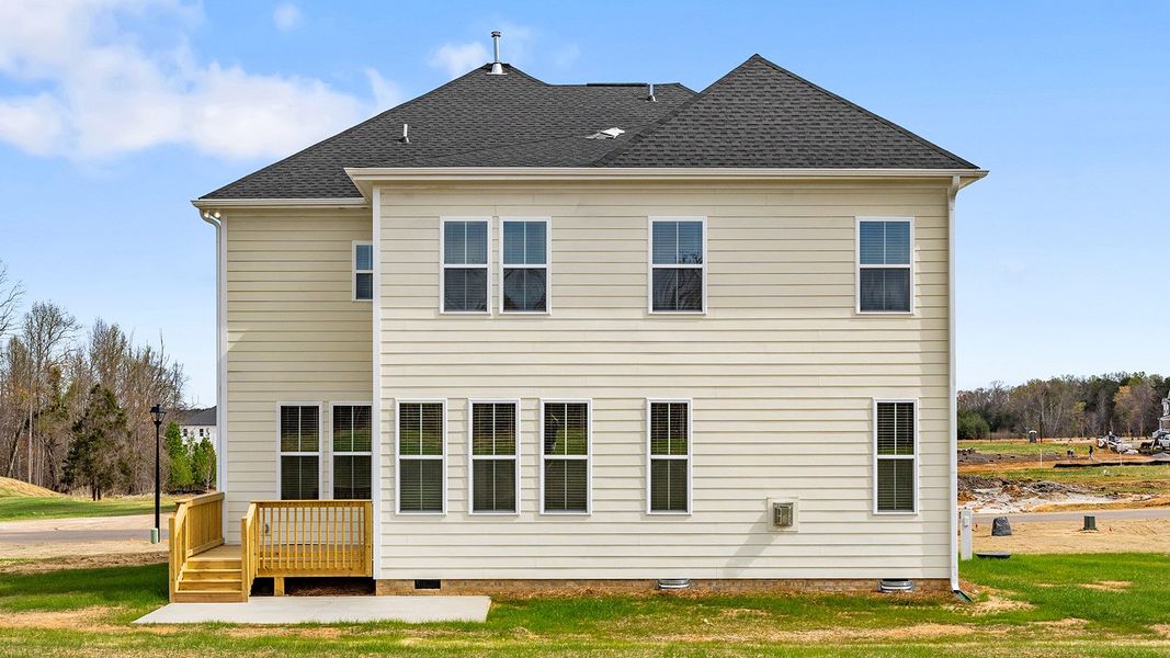 Exterior details and patio area of a home in Lilah Grove, Summerfield (Image 23).